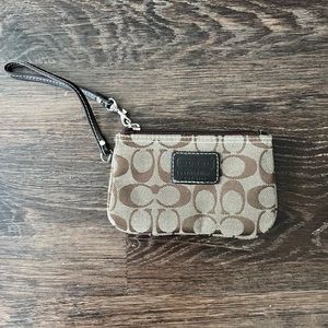 Brown and tan coach wristlet